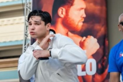 "Coach Prime's Son Defends Garcia Amidst NYSAC Head's Resignation: 'A Backpedal Like Deion Sanders!'"