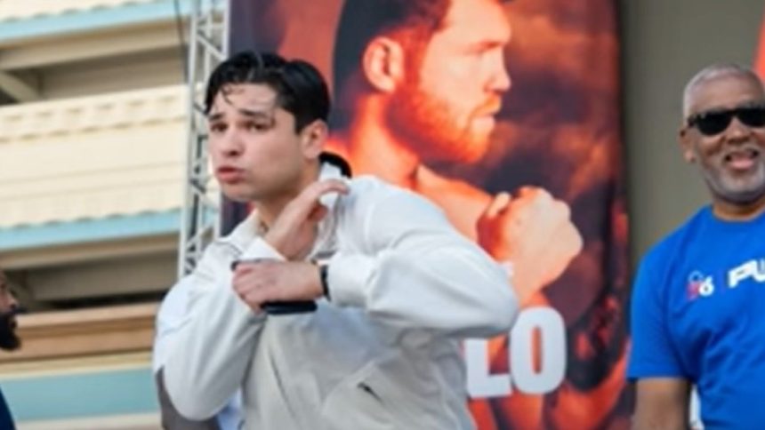 "Coach Prime's Son Defends Garcia Amidst NYSAC Head's Resignation: 'A Backpedal Like Deion Sanders!'"