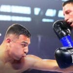 "Leo Delivers a Devastating Left Hook to Secure IBF Featherweight Title in Hometown Triumph"