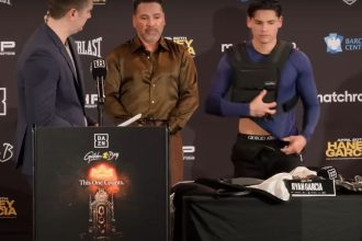 "Garcia and Tate's Unlikely Bond: Boxing Sensation Seeks Guidance Amid Social Media Turmoil!"