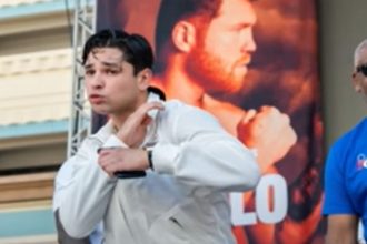 "Coach Prime's Son Defends Garcia Amidst NYSAC Head's Resignation: 'A Backpedal Like Deion Sanders!'"