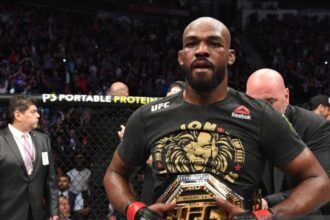 "Jon Jones' Shocking Prediction: Ronda Rousey vs. Floyd Mayweather Debate Rekindled"