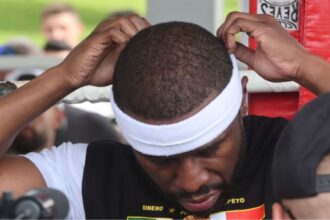 “Floyd Mayweather vs. John Gotti III: Referee Swap and Timekeeper Mishap Rock Wild Rematch”